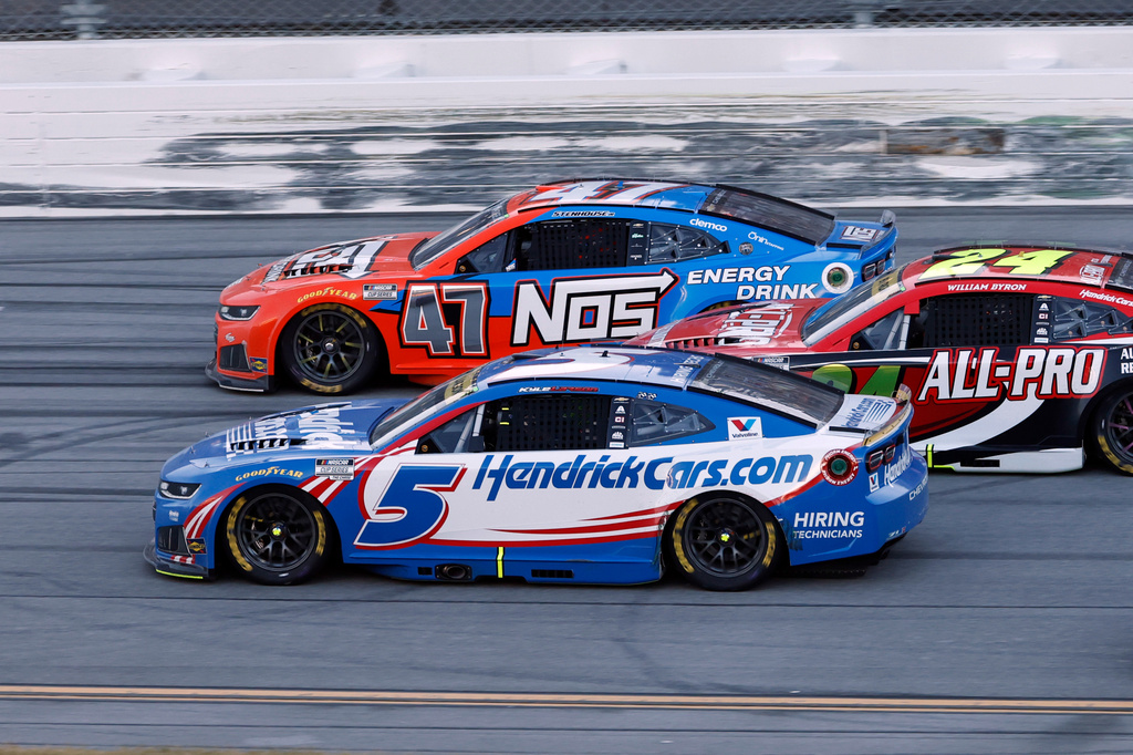 Kyle Larson (5) passes Ricky Stenhouse Jr. (47) for the win in a NASCAR Cup Series auto race, Sunday, Oct. 25, 2026, in Talladega, Ala. (AP Photo/Butch Dill)
