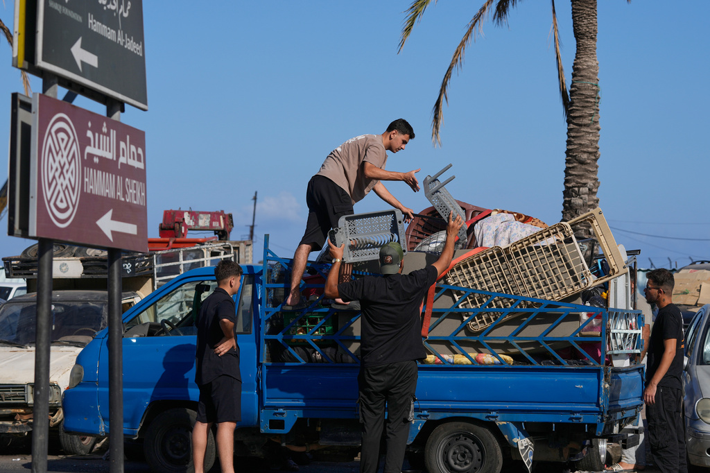 Displaced people pack their belongings as they prepare to return to their village following the announcement of an initial ceasefire agreement between the United States and Iran, in the southern port city of Sidon, Lebanon, Monday, June 15, 2026. (AP Photo/Mohammed Zaatari)
