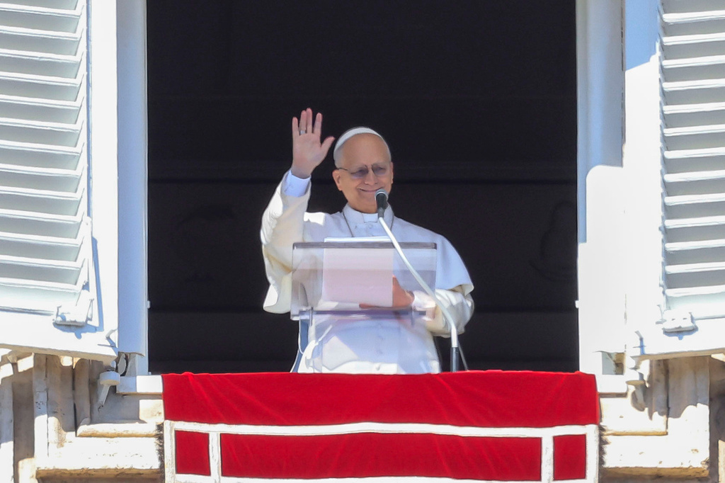 Pope Leo XIV appears at the window of his studio overlooking St. Peter's Square at the Vatican where Catholic faithful and pilgrims gathered for the traditional Sunday blessing at the end of the noon Angelus prayer, Sunday, Feb. 22, 2026. (AP Photo/Riccardo De Luca)