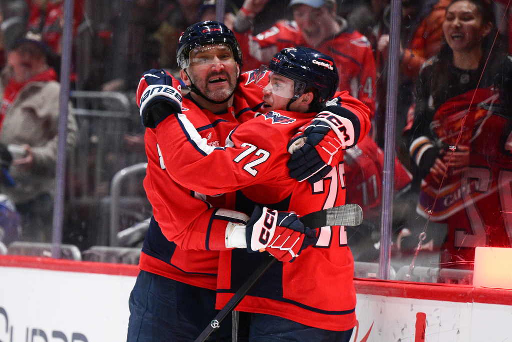 Washington Capitals left wing Anthony Beauvillier (72) celebrates his goal with left wing Alex Ovechkin, left, during the second period of an NHL hockey game against the New York Islanders, Monday, Feb. 2, 2026, in Washington. (AP Photo/Nick Wass)