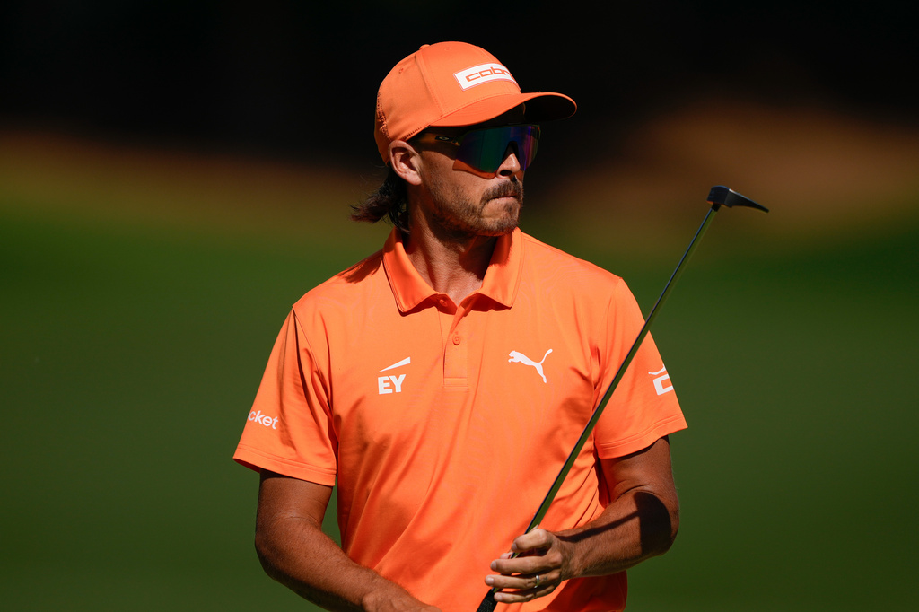 Rickie Fowler walks on the 15th hole during the final round of the Truist Championship golf tournament at the Quail Hollow Club, Sunday, May 10, 2026, in Charlotte, N.C. (AP Photo/Chris Carlson)