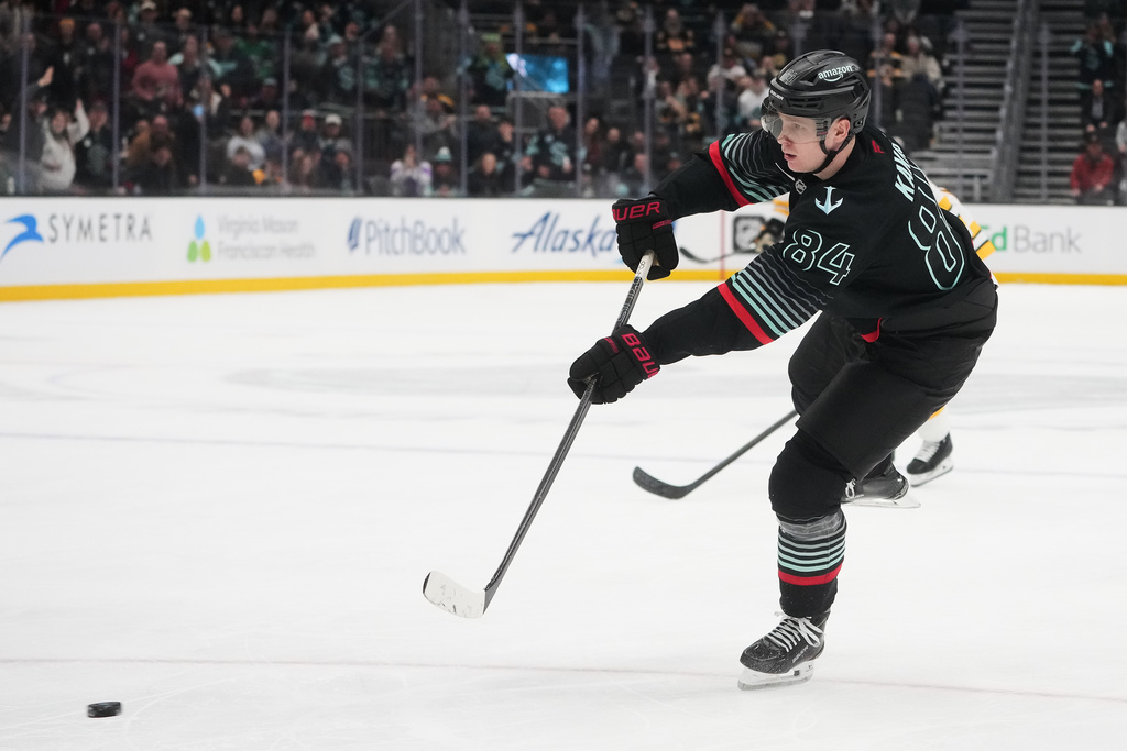 Seattle Kraken right wing Kaapo Kakko scores an empty net goal against the Boston Bruins during the third period of an NHL hockey game Tuesday, Jan. 6, 2026, in Seattle. (AP Photo/Lindsey Wasson)