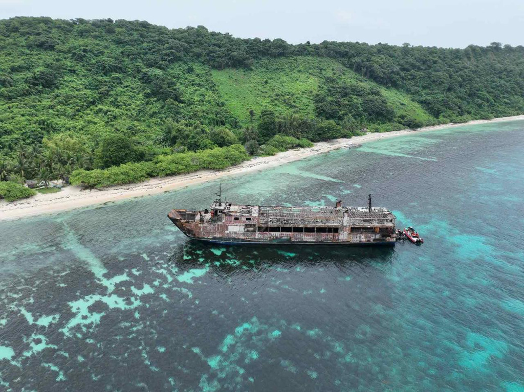 This photo provided by the Philippine Coast Guard shows the ferry MV June Aster off Palawan province, western Philippines, Friday, Sept. 11, 2026, days after it caught fire. (Philippine Coast Guard via AP)