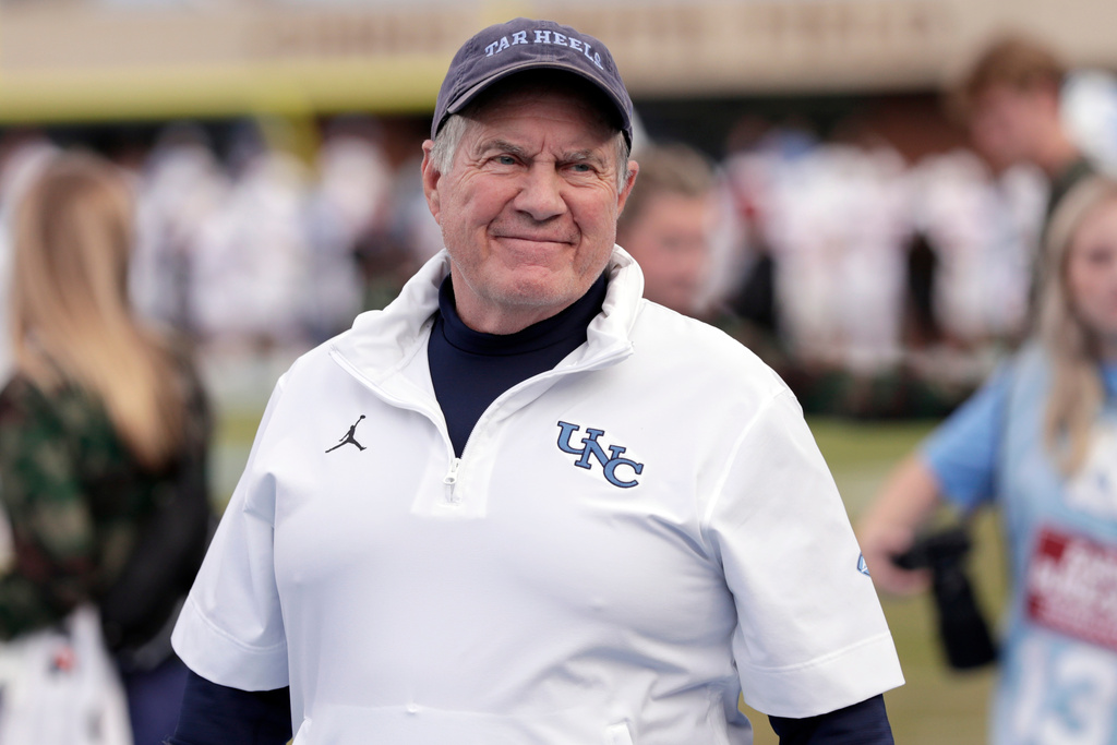 North Carolina head coach Bill Belichick smiles as he walks the sidelines before an NCAA college football game against Stanford, Saturday, Nov. 8, 2025, in Chapel Hill, N.C. (AP Photo/Chris Seward)