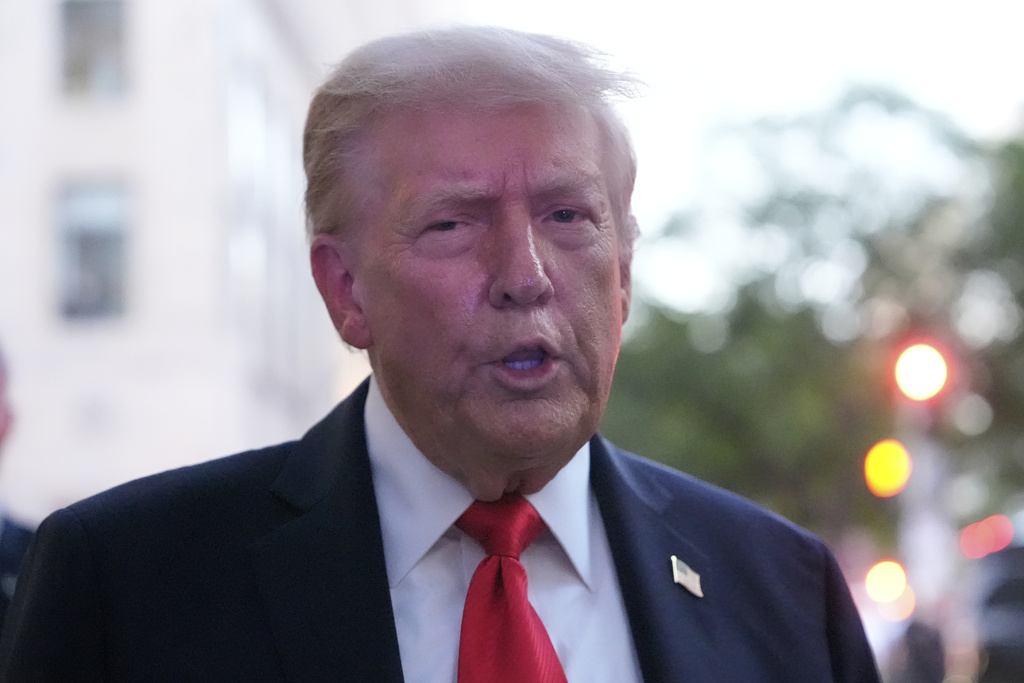 President Donald Trump speaks to reporters before he enters a restaurant near the White House, Tuesday, Sept. 9, 2025, in Washington, to have dinner. (AP Photo/Alex Brandon)