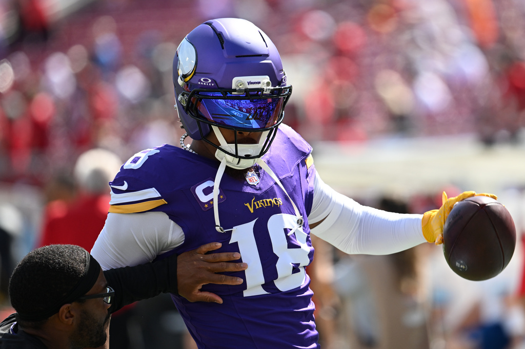 Minnesota Vikings wide receiver Justin Jefferson (18) warms up before an NFL football game against the Tampa Bay Buccaneers in Tampa, Fla., Sunday, Sept. 27, 2026. (AP Photo/Jason Behnken)