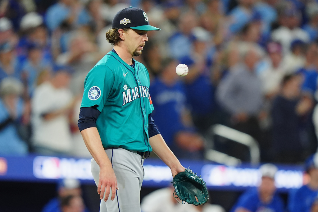 Seattle Mariners pitcher Logan Gilbert looks on after giving up a two-run home run to the Toronto Blue Jays during the third inning in Game 6 of baseball's American League Championship Series in Toronto, Sunday, Oct. 19, 2025. (Frank Gunn/The Canadian Press via AP)