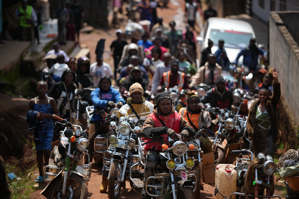 People wait for Pope Leo XIV in Bamenda, Cameroon, Thursday, April 16, 2026, on the fourth day of his 11-day pastoral visit to Africa. (AP Photo/Andrew Medichini)