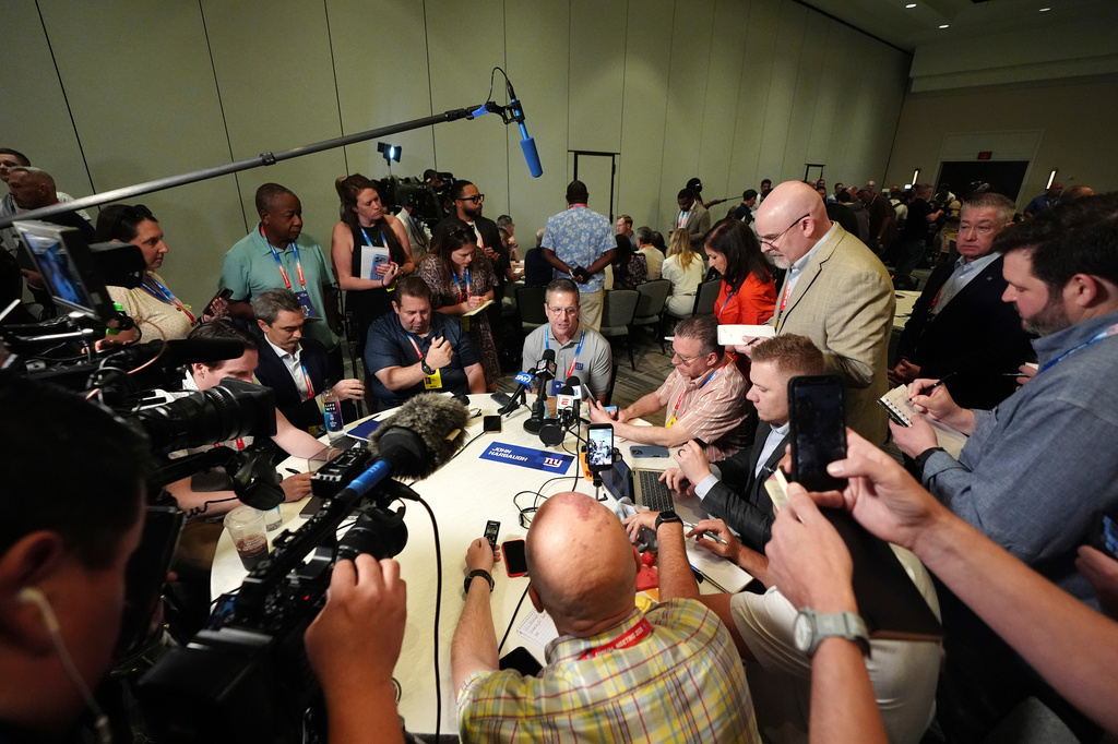 New York Giants head coach John Harbaugh talks with reporters at the annual NFL football meetings, Monday, March 30, 2026, in Phoenix. (AP Photo/Ross D. Franklin)