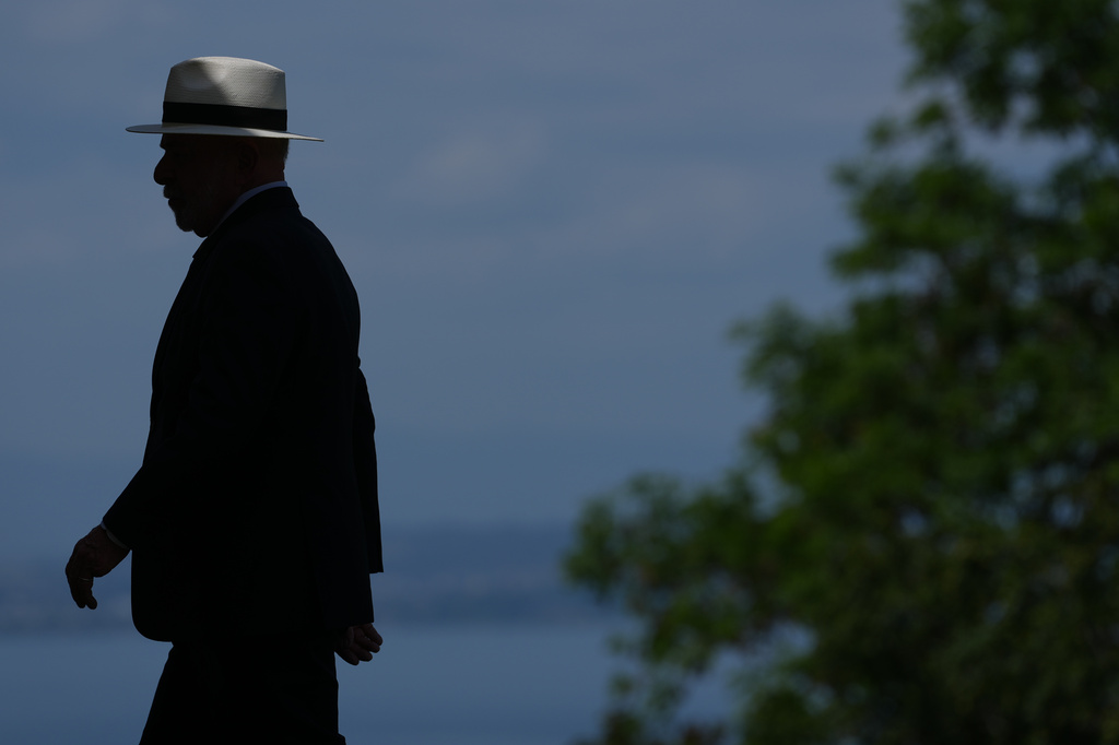 Brazil's President Luiz Inacio Lula da Silva walks toward the podium prior to a group photo of G7 leaders and invited nations during the G7 summit in Evian-les-Bains, France, Tuesday, June 16, 2026. (AP Photo/Thibault Camus)