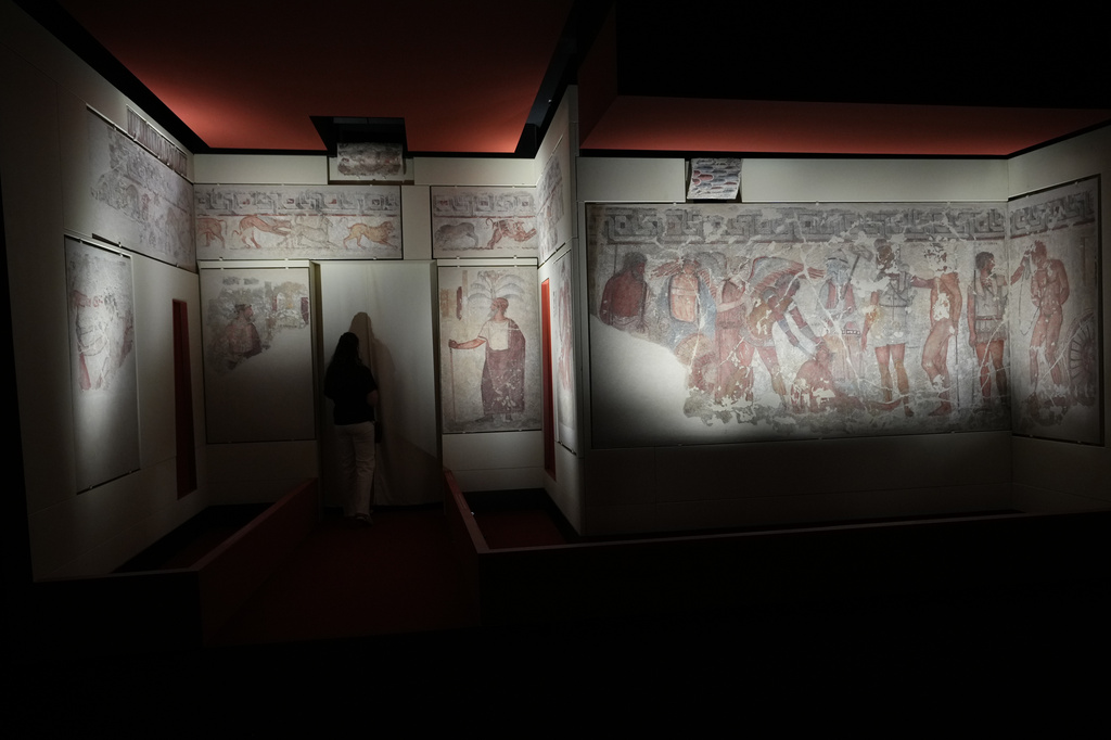 Reporters visit the frescoes, dating from 330–310 B.C., exhibited in the reconstruction of the François Tomb, an Etruscan tomb, at the Villa Giulia Etruscan Museum in Rome, Tuesday, June 30, 2026. (AP Photo/Alessandra Tarantino)