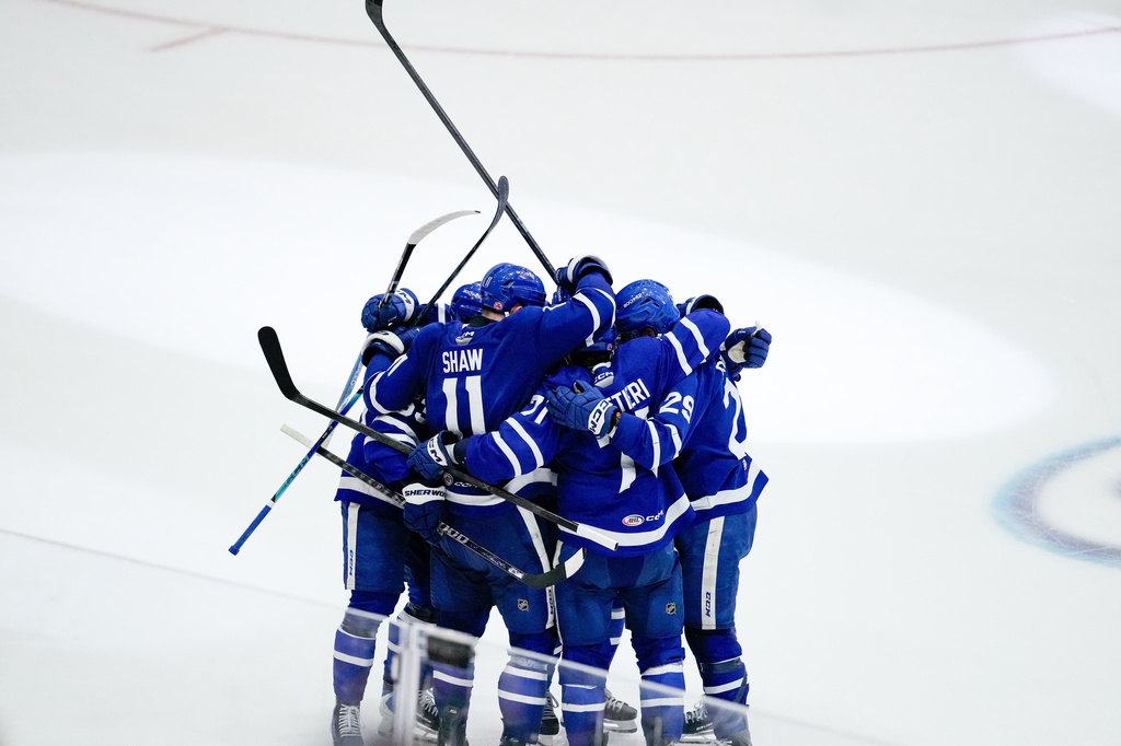 Toronto Marlies' Vinni Lettieri (71) celebrates with his teammates after scoring a goal on the Chicago Wolves during the second period in Game 5 of the AHL hockey Calder Cup final in Toronto, Friday, June 19, 2026. (Arlyn McAdorey/The Canadian Press via AP)