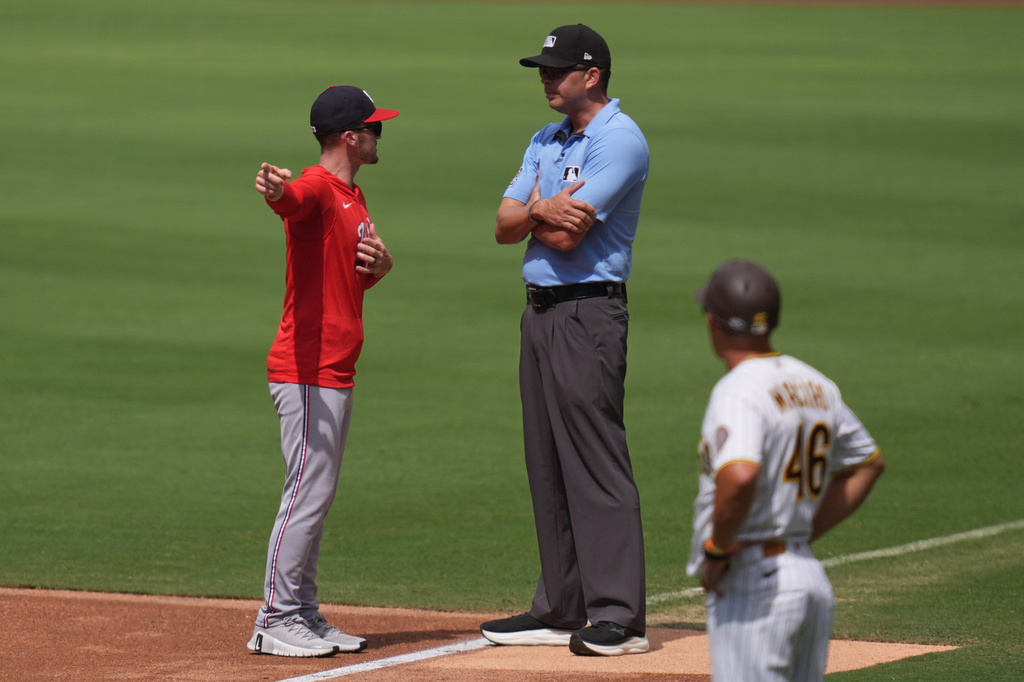 Washington Nationals manager Blake Butera, left, talks with first base umpire Emil Jimenez before being ejected during the third inning of a baseball game against the San Diego Padres Wednesday, Sept. 9, 2026, in San Diego. (AP Photo/Gregory Bull)