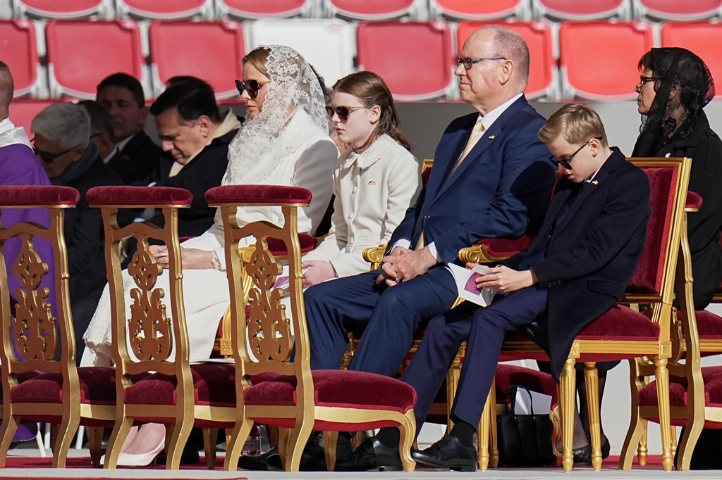 From left, Princess Charlen of Monaco , Crown Princess Gabriella, Prince Albert II of Monaco, and Prince Jacques attend a mass presided over by Pope Leo XIV at Stade Louis II in Fontvieille, Monaco, Saturday, March 28, 2026. (AP Photo/Laurent Cipriani)
