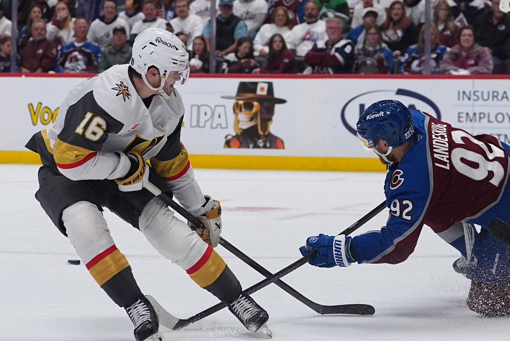 Colorado Avalanche left wing Gabriel Landeskog, right, blocks the shot by Vegas Golden Knights right wing Pavel Dorofeyev during the second period in Game 1 of the Western Conference finals NHL hockey Stanley Cup playoff series Wednesday, May 20, 2026, in Denver. (AP Photo/David Zalubowski)