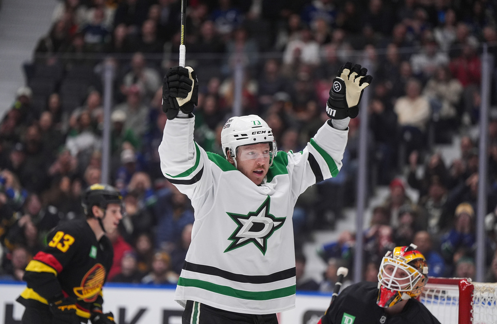 Dallas Stars' Adam Erne (73) celebrates his goal against Vancouver Canucks goalie Nikita Tolopilo during the first period of an NHL hockey game, in Vancouver, Monday, March 2, 2026. (Darryl Dyck/The Canadian Press via AP)