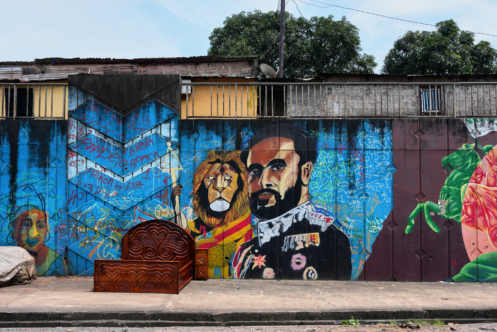 A mural depicting Haile Selassie painted by Omar Diaw on a street wall in Conakry, Guinea, Saturday, Sep. 20, 2025. (AP Photo/Misper Apawu)
