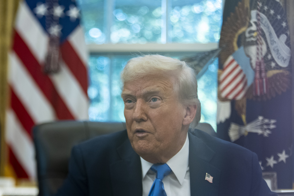 President Donald Trump speaks with reporters in the Oval Office of the White House, Friday, Sept. 19, 2025, in Washington. (AP Photo/Alex Brandon)