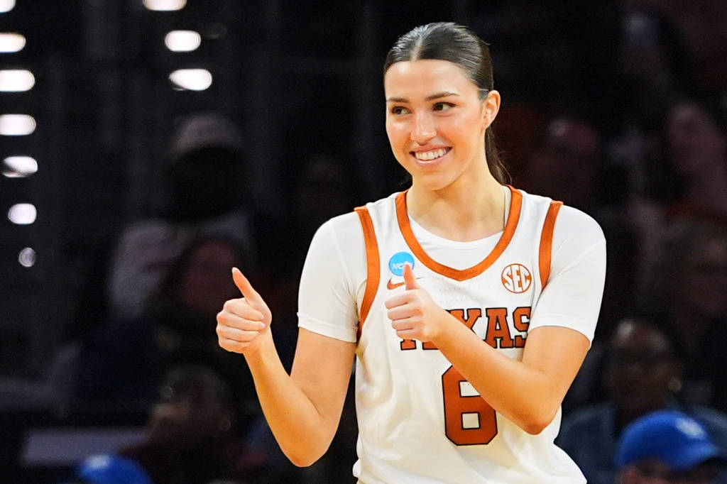 Texas' Sarah Graves signals to teammates late in the second half in the Sweet 16 of the NCAA college basketball tournament against Kentucky, Saturday, March 28, 2026, in Fort Worth, Texas. (AP Photo/LM Otero)
