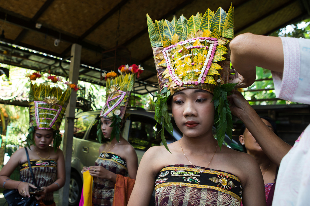 Ketut Alit Widiantary prepares to perform the sacred Rejang dance during Kuningan holiday, which marks the end of the 10-day Galungan festival celebrating the victory of good over evil, in Karangasem, Bali, Indonesia, Saturday, June 27, 2026. (AP Photo/Firdia Lisnawati)