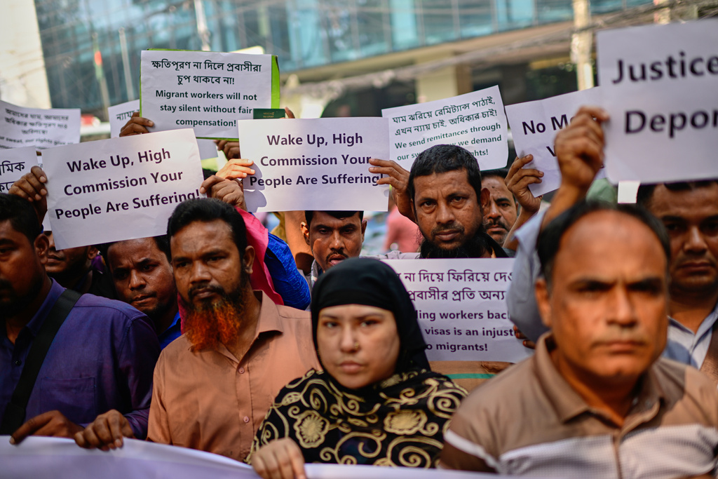 Bangladeshi workers who were employed by Malaysian companies protest in front of the Ministry of Expatriates' Welfare and Overseas Employment demanding unpaid wages, fair compensation and an end to alleged abuse by Malaysian employers, in Dhaka, Bangladesh, Monday, Nov. 10, 2025. (AP Photo/Mahmud Hossain Opu)