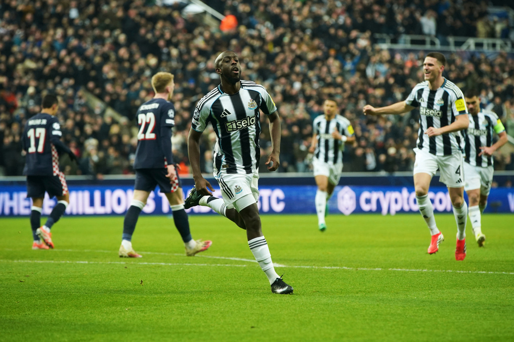 Newcastle's Yoane Wissa, center, celebrates after scoring his side's opening goal during the Champions League soccer match between Newcastle and Paris Saint-Germain in Newcastle, England, Wednesday, Jan. 21, 2026. (AP Photo/Ian Hodgson)