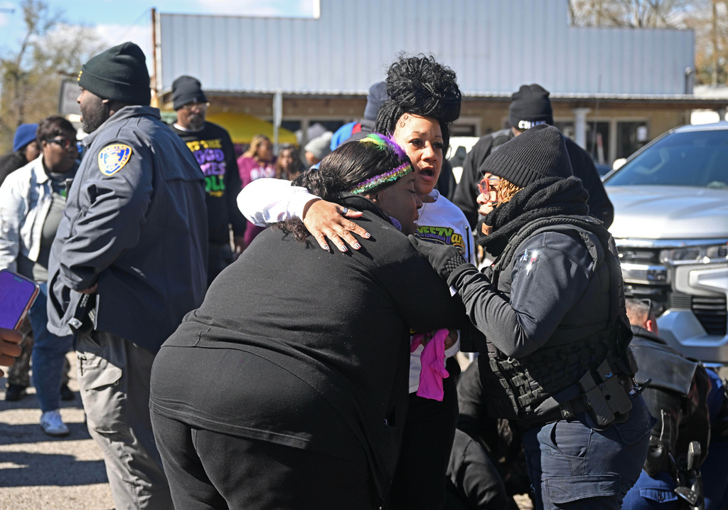 People react near the scene of a shooting at the Clinton Mardi Gras Parade in Baton Rouge, La., on Saturday, Jan. 31, 2026. (Hilary Scheinuk/The Advocate via AP)