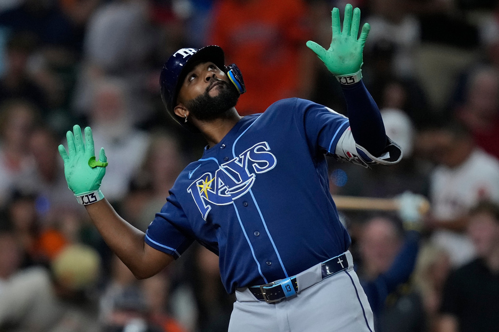 Tampa Bay Rays' Junior Caminero celebrates after hitting a solo home run during the seventh inning of a baseball game against the Houston Astros, Friday, July 3, 2026, in Houston. (AP Photo/Kevin M. Cox)