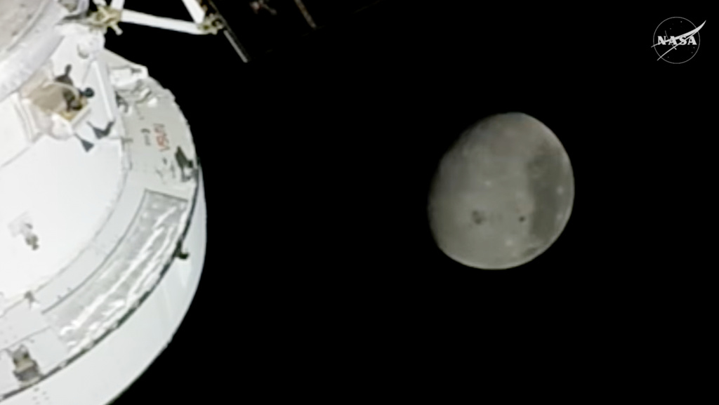 In this image from video provided by NASA, the Moon is seen from a camera outside the Orion Spacecraft after the Artemis II astronauts surpassed the farthest distance ever traveled by humans from Earth, Monday, April 6, 2026. (NASA via AP)