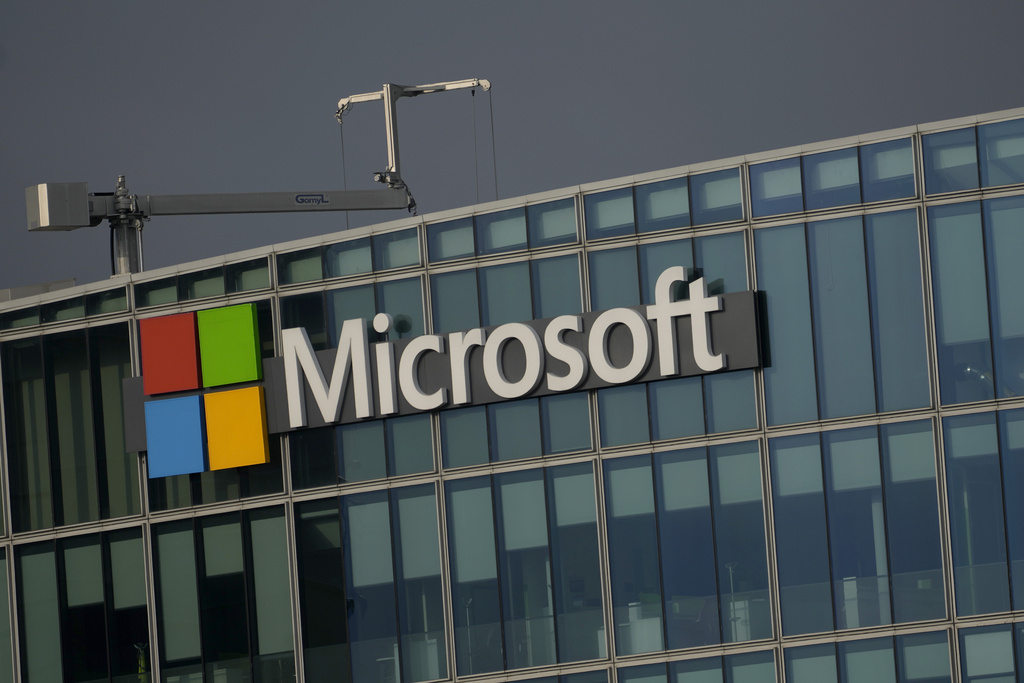 FILE - The logo of Microsoft is seen outside its French headquarters in Issy-les-Moulineaux, outside Paris, on May 13, 2024. (AP Photo/Thibault Camus, File)