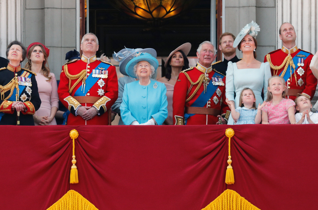 FILE - In this Saturday, June 9, 2018 file photo, from left, Britain's Princess Anne, Princess Beatrice, Prince Andrew, Queen Elizabeth, Meghan, Duchess of Sussex, Prince Charles, Prince Harry, Kate, Duchess of Cambridge and Prince William attend the annual Trooping the Colour Ceremony in London. Sunday, May 19, 2019 marks the first wedding anniversary of Prince Harry and his wife Meghan, the Duchess of Sussex. (AP Photo/Frank Augstein, File)