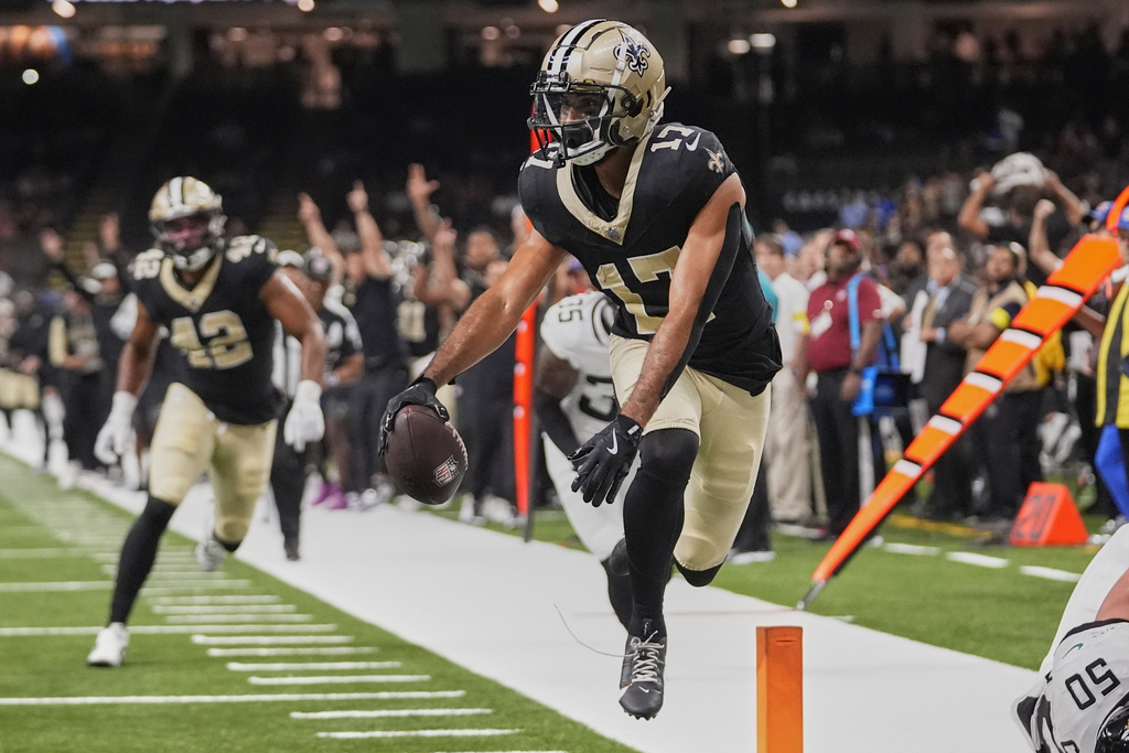 New Orleans Saints wide receiver Dante Pettis (17) scores a touchdown against the Jacksonville Jaguars on a 20-yard pass play in the second half of an NFL preseason football game in New Orleans, Sunday, Aug. 17, 2025. (AP Photo/Gerald Herbert)
