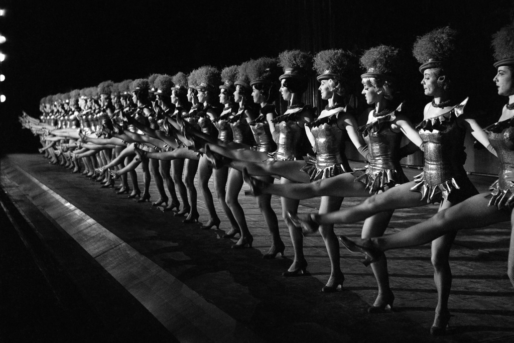 FILE - The 36 Rockettes go through a dance number as they rehearse for their Christmas show at Radio City Music Hall in New York in December 1963. (AP Photo/Dan Grossi, File)
