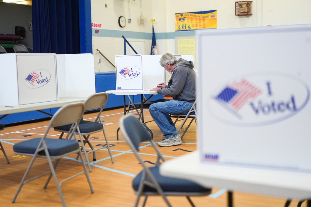 A person votes in the Virginia redistricting referendum at Lyles-Crouch Traditional Academy, Tuesday, April 21, 2026, in Alexandria, Va. (AP Photo/Julia Demaree Nikhinson)