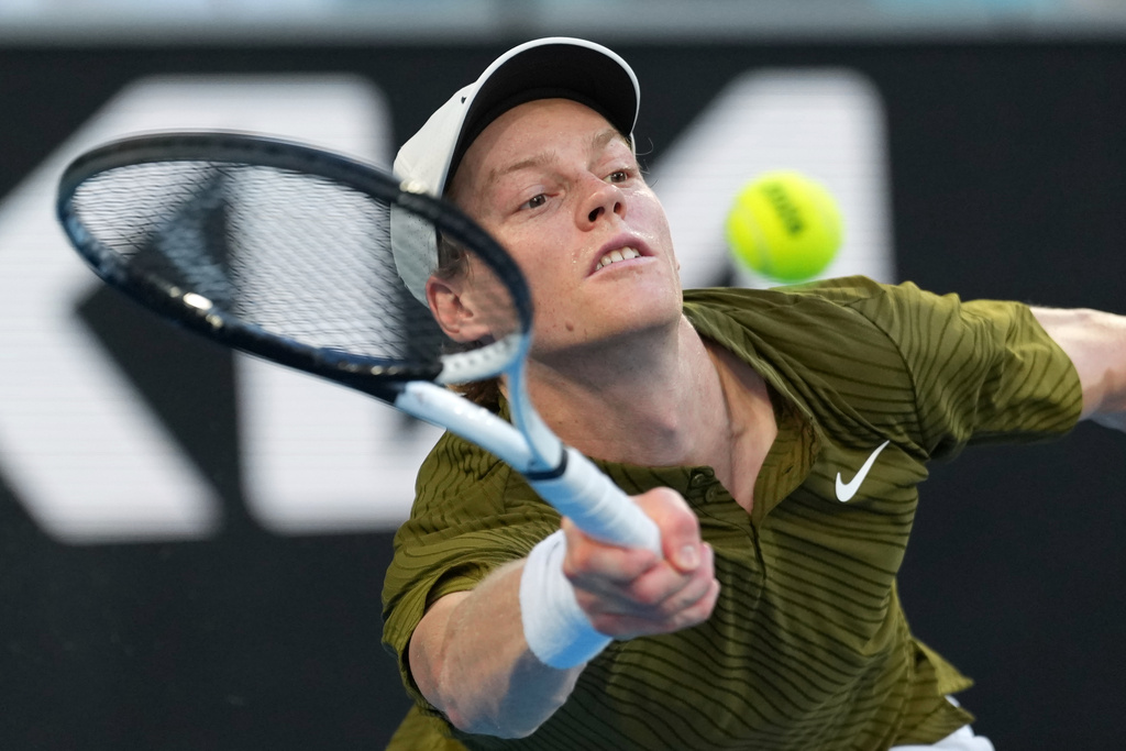 Jannik Sinner of Italy plays a forehand return to his compatriot Luciano Darderi during their fourth round match at the Australian Open tennis championship in Melbourne, Australia, Monday, Jan. 26, 2026. (AP Photo/Dar Yasin)