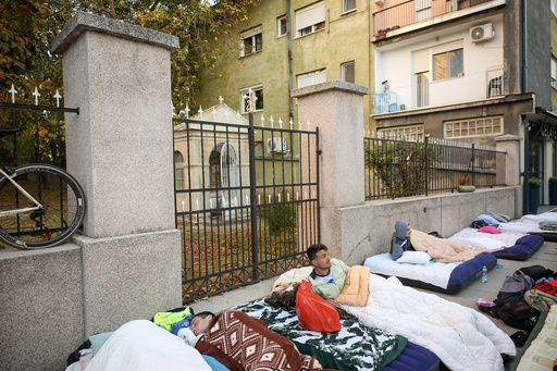 Students rest on the street prior to the start of their march to Novi Sad for a huge rally on Nov. 1 marking the first anniversary of a train station disaster that killed 16 people, in Indjija, Serbia, Friday, Oct. 31, 2025. (AP Photo/Armin Durgut) Students rest on the street prior to the start of their march to Novi Sad for a huge rally on Nov. 1 marking the first anniversary of a train station disaster that killed 16 people, in Indjija, Serbia, Friday, Oct. 31, 2025. (AP Photo/Armin Durgut)