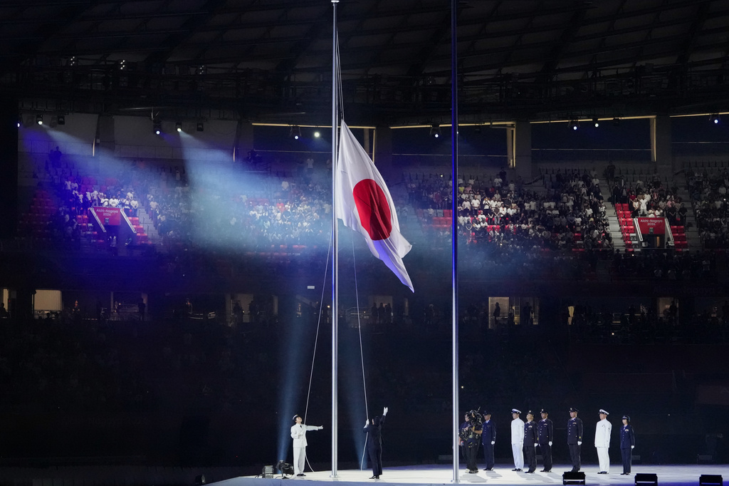 Japanese flag is unfurled during the opening ceremony for the Asian Games in Nagoya, Japan, Saturday, Sept. 19, 2026. (AP Photo/Aaron Favila)