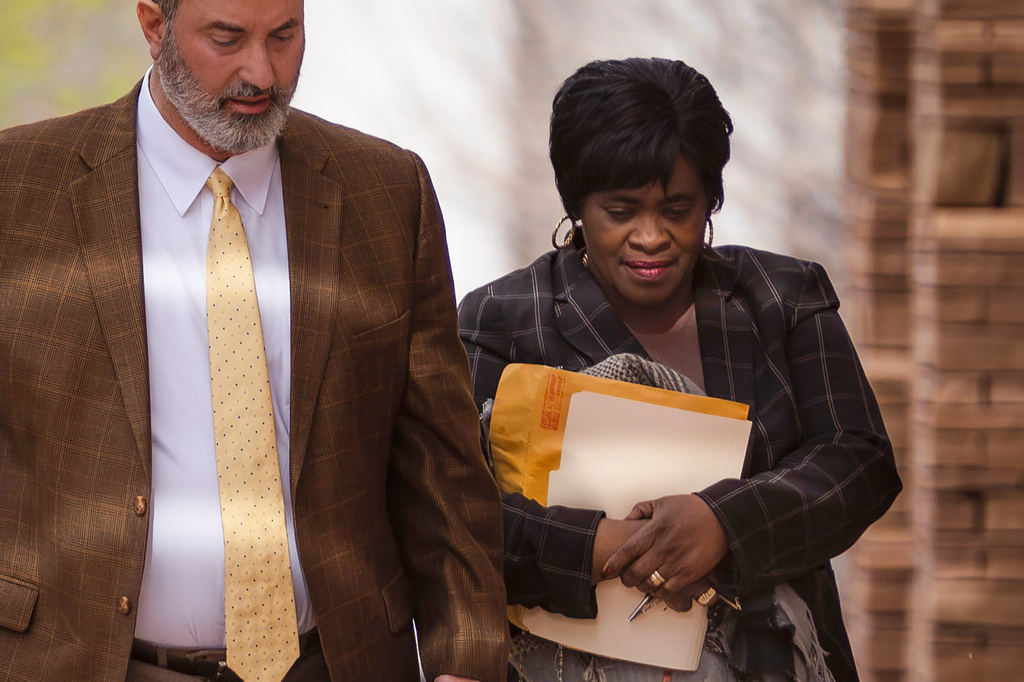 FILE - Sheryl Williams Stapleton, a former state House majority leader and APS employee, right, walks with her attorney Ahmad Assed, left, to make her first appearance in U.S. District Court in Albuquerque, N.M., on Tuesday, April 9, 2024. (Chancey Bush/The Albuquerque Journal via AP, File)