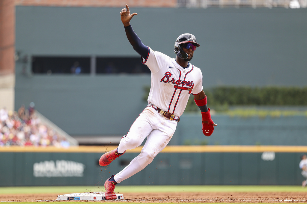 Atlanta Braves' Jurickson Profar rounds third base in the third inning of a baseball game against the Miami Marlins, Saturday, Aug. 9, 2025, in Atlanta. (AP Photo/Colin Hubbard)