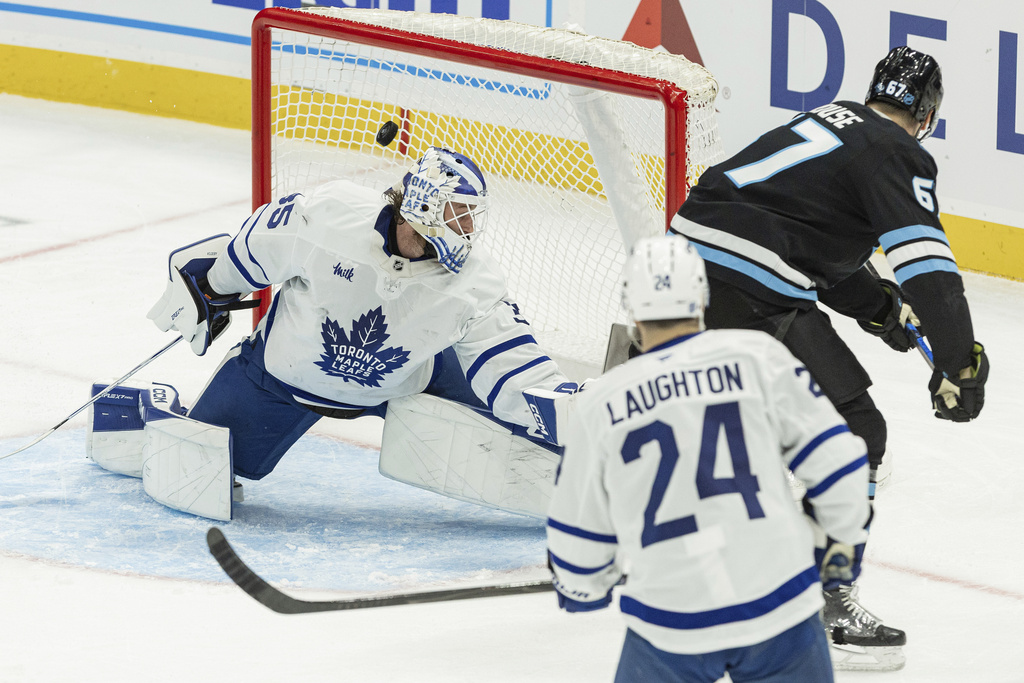 Utah Mammoth left wing Lawson Crouse (67) shoots the puck against Toronto Maple Leafs goalie Dennis Hildeby (35) during the third period of an NHL hockey game Tuesday, Jan. 13, 2026, in Salt Lake City. (AP Photo/Melissa Majchrzak)
