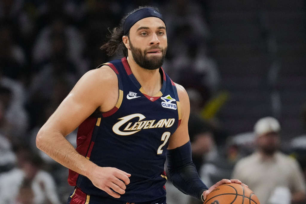 FILE - Cleveland Cavaliers' Max Strus dribbles the ball down the court in Game 3 of a second-round NBA playoffs basketball series, May 9, 2026 in Cleveland. (AP Photo/Sue Ogrocki, File)