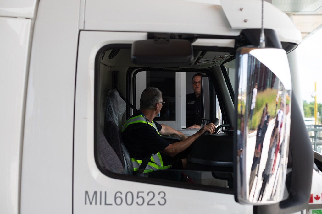 A Canada Border Services agent performs a mock questioning of a trucker at the Gordie Howe International Bridge, in Windsor, Ontario, Canada, Friday, July 24, 2026. (Dax Melmer/The Canadian Press via AP)