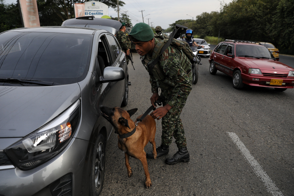 Soldiers inspect a car at a security checkpoint ahead of the inauguration of President-elect Abelardo de la Espriella in Cali, Colombia, Wednesday, Aug. 5, 2026. (AP Photo/Santiago Saldarriaga)