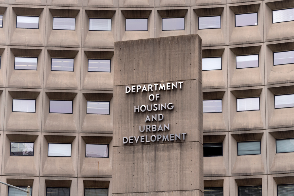 FILE - A sign for the Department of Housing and Urban Development stands outside the agency's headquarters, Jan. 16, 2026, in Washington. (AP Photo/Mark Schiefelbein, File)