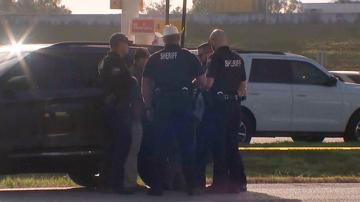 Law enforcement officials investigate a vehicle near the scene of a deadly shooting shooting early Saturday, Oct. 4, 2025 in the Houston suburb of Angleton, Texas. (KTRK via AP) Law enforcement officials investigate a vehicle near the scene of a deadly shooting shooting early Saturday, Oct. 4, 2025 in the Houston suburb of Angleton, Texas. (KTRK via AP)
