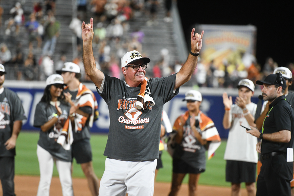 Texas head coach Mike White celebrates after his team defeated Texas Tech to win the Women's College World Series softball championship in Oklahoma City, Thursday, June 4, 2026. (AP Photo/Kyle Phillips)