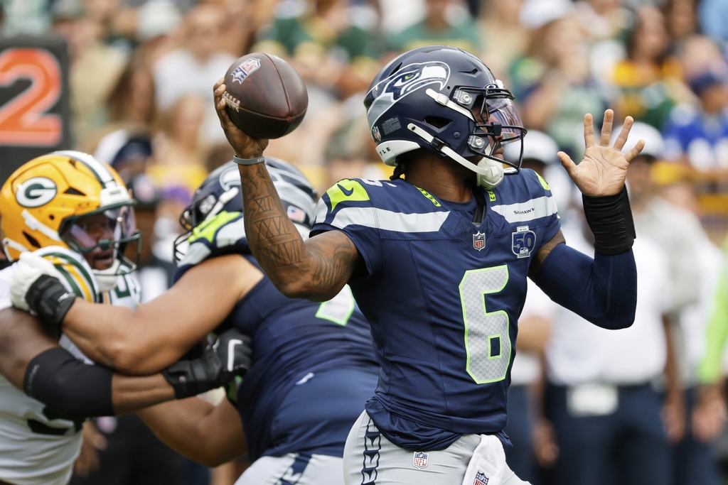 Seattle Seahawks' Jalen Milroe thorws during the first half of a preseason NFL football game against the Green Bay Packers Saturday, Aug. 23, 2025, in Green Bay, Wis. (AP Photo/Mike Roemer)