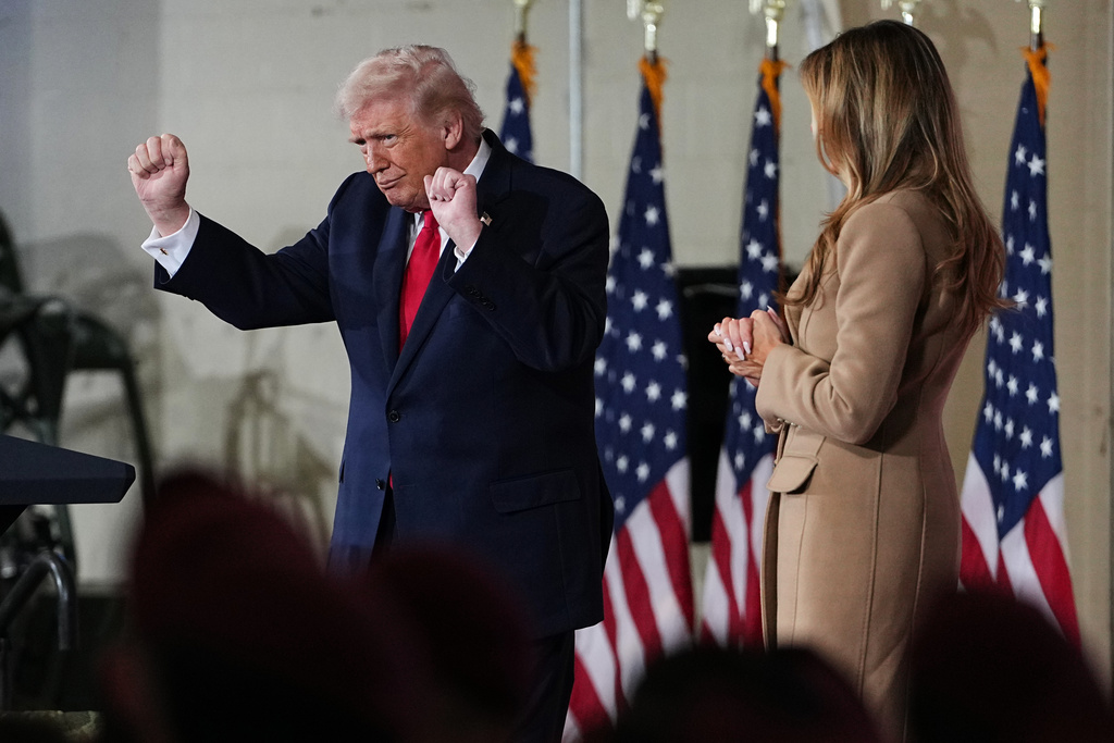 President Donald Trump dances as first lady Melania Trump watching after speaking to soldiers and their families at Fort Bragg, N.C., Friday, Feb. 13, 2026. (AP Photo/Matt Rourke)