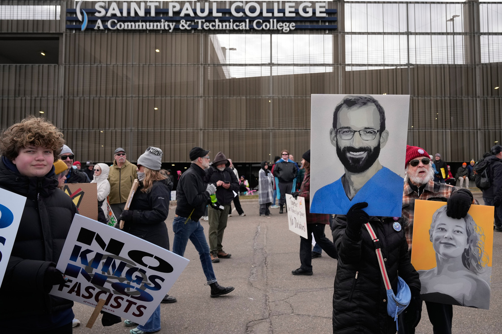 People gather outside Saint Paul College before a "No Kings" protest Saturday, March 28, 2026, in St. Paul, Minn. (AP Photo/Joe Scheller)