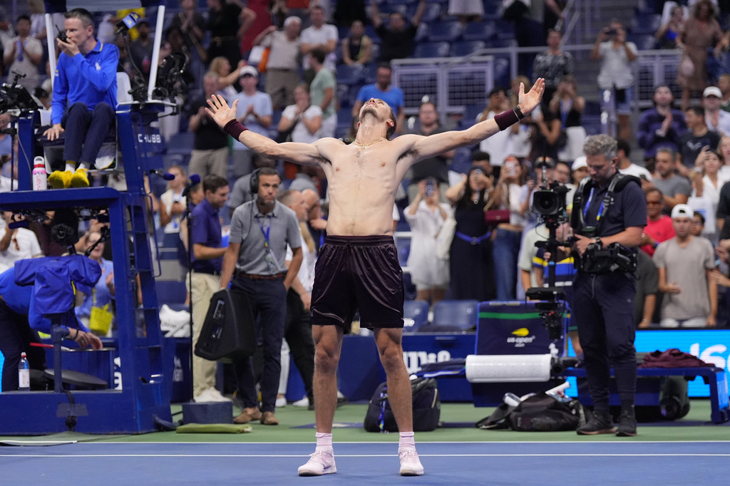 Alexander Zverev, of Germany, celebrates after defeating Quentin Halys, of France, in five sets in the the second round of the U.S. Open tennis championships, early Friday, Sept. 4, 2026, in New York. (AP Photo/Frank Franklin II)